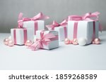 white gifts with pink ribbons.... | Shutterstock . vector #1859268589