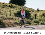 Small photo of Speloncato, Corsica, France - 7th June 2022: Maximilien Couvreur competes in the 2022 BikingMan Corsica race as he reaches the 1100m Col de Battaglia above the village of Speloncato