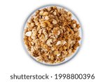 Nuts oatmeal granola on a white isolated background. the toning. selective focus