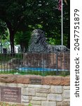 Small photo of Lancaster, Pa. USA September 25, 2021 The statue of a reclining bronze lion, set on a stone base that fronts an oval pool, was dedicated in June 1905. It was designed by Blanche Nevin.