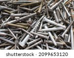 Small photo of tapping screws made od steel, metal screw, iron screw, chrome screw, screws as a background, wood screw