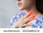 Small photo of Close up of woman coughing while she having sore throat problem. A sore throat is a painful, dry, or scratchy feeling in the throat.
