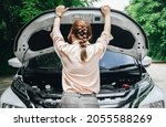 Small photo of Rear view of Asian woman opened car hood for looking the problem of car breakdown while waiting for assistance on the road side. Car breakdown it will happen to you at least once in your driving life.