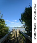 Small photo of Kelowna, British Columbia, Canada- June 12, 2021: scenic photo of Sibelle Maude-Roxby Wetlands Boardwalk hike trail; perfect spot for bird sanctuary watchers and tourists near Kelowna General Hospital