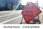Road Work Ahead Sign By The...