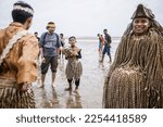 Small photo of A Malaysian indigenous Mah Meri tribesman wears a traditionally crafted mask as he dances during the "Puja Pantai" ritual, in Carey Island on the outskirts of Kuala Lumpur on January 26, 2023.