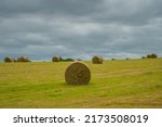 Hay bales in at a hilly field in Wales