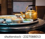 Makgeolli drink with Korean traditional food Pajeon on table in restaurant Korea gourmet travel 