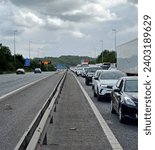 Small photo of Preston, Lancashire, United Kingdom, July 2, 2023. Cars and trucks stuck stationary on the M6 motorway road near Preston. Frustrating holiday traffic congestion delay. Outdoors, overcast summer day