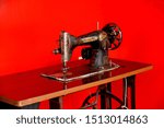 Small photo of Kochi /Cochin Kerala; India; Asia; Nov. 2017 : Ventage NALY sewing machine on red background