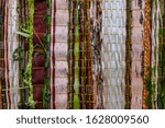 Small photo of Closeup full frame shot of wooden bamboos and strips decoration with braided leaves representing abstract wampum in event outdoor