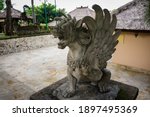 Close up of statue of Singha Barong Winged Lion Spirit (Griffin) for daily worship or prayer. Mythical creature in Hinduism of Balinese culture. No people.
