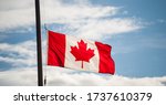 Small photo of Canadian Flag Waving At Half-mast