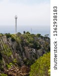 Small photo of Eden, Victoria, Australia - December 19 2017: The lighthouse at Eden Lookout Point between Twofold Bay and Nullica Bay