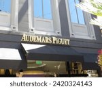 Small photo of Los Angeles, California, USA, June 21, 2022: Audemars Piguet Two Rodeo Drive street sign in Beverly Hills.