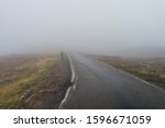 Heavy fog on the road. Scotland single track. Misty road.