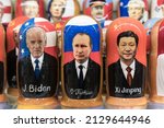 Small photo of Moscow , Russia - February 26, 2022: Putin, Biden and Xi Jinping in the form of Russian nesting dolls in a gift shop in Moscow. Relations between Russia, USA and China