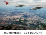 View from airplane window on city in wing with top view of Prague