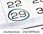 Small photo of twenty-ninth of the month highlighted on the calendar with a frame close-up macro, mark on the calendar, twenty-ninth date