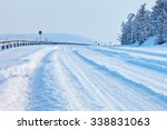 Snow-covered road on a winter day