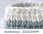 Small photo of Gray green and white crocheted basket, stuff organizer, crochet baskets bottom, pattern for crocheting, nature-friendly sustainable handicraft business, cute interior items. Space for your text