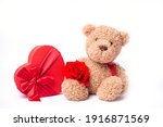 teddy bear hold red rose and heart shaped box valentine's day isolated on white background