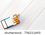 Small photo of Pack of cigarettes with cigarettes sticking out