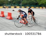 Small photo of KUALA LUMPUR-APRIL 14: YellowBikeCompany rider Muhamad Hafiz takes corner in front of Peter Pelanin from Indonesia during 24/7 Bigtime Criterium Race at KL Speed City on April 14, 2012 in Kuala Lumpur, Malaysia.