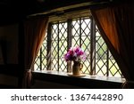 Vase Of Flowers By The Window.