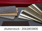 Small photo of Samples of fibreboard panels with wood texture. Laminated CPD. Chipboard PVC edge. Wooden furniture CMD and MDF.