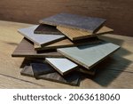 Small photo of Samples of fibreboard panels with wood texture. Laminated CPD. Chipboard PVC edge. Wooden furniture CMD and MDF.