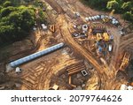 Small photo of Concrete sewer pipes for laying external sewage system at construction site. Tunnel boring machine in storm sewer collector for underground construction of sewers, pipe, drainage systems.