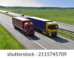 Small photo of Highway with Lots of semi-trailer trucks . Big lorry traffic on the road. Truck driving along on roadway overtakes another truck. Services and Transport logistics. Russia, Moscow, JUN 07, 2021