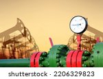 Small photo of Pressure gauge on an oil pipe in an oil field. Crude oil Pumpjack and natural gas pipeline. Fossil crude production. Drill rig and drilling derrick. Global crude oil Prices. Petroleum demand.