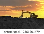 Small photo of Coal mining. Excavator on earthmoving at open pit mining. Backhoe dig ore in quarry on sunset. Heavy construction equipment and Heavy Machinery during excavation. Excavator on iron ore mining.