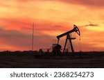 Small photo of Oil prices on global market. Crude oil Pumpjack on oilfield on sunset. Fossil crude production. Oil drill rig and drilling derrick. Global crude oil Prices, petroleum demand OPEC+. Pump jack, oilfield