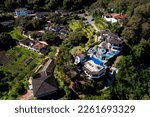 Small photo of Banos, Ecuador, 1-10-2023: Aerial view of the hotel Luna Volc?n from a distance