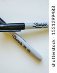 Small photo of PRINCETON, NJ -17 SEP 2019- View of two Fine Point Sharpie permanent black marker pens. Sharpies are the favorite writing tool of President Donald Trump.