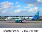 Small photo of MIAMI, FL -13 MAR 2022- View of an airplane from Frontier Airlines (F9) with a Mia the Dolphin livery at the Miami International Airport (MIA), formerly Wilcox Field.