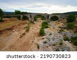 Small photo of ROUSSILLON, FRANCE -1 JUL 2021- View of a completely dried up river bed a drought near Roussillon in Vaucluse, Provence, France.