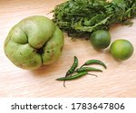 Small photo of Local vegetable ingredients of Assamese cuisine. These includes elephant apple, fiddle head fern fronds, green chilli and a special variety of lemon found in Assam called Gol nemu in local language.