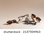 Sunglasses and glasses sale concept. Trendy sunglasses on beige background. Trendy Fashion summer accessories. Copy space for text. Summer sale. Optic store discount poster. Minimalism