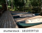 Docked Rowboats On A Lake 