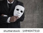 Businessman Holding White Mask...