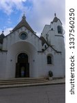 Small photo of Alberobello, Italy - 14.02.19: View of the Church of Sant'Antonio di Padova, known as the Hammer of the Heretics, built for 14 months in 1927 using the same traditional technique as for the trullo.