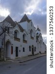 Small photo of Alberobello, Italy - 14.02.19: View of the Church of Sant'Antonio di Padova, known as the Hammer of the Heretics, built for 14 months in 1927 using the same traditional technique as for the trullo.