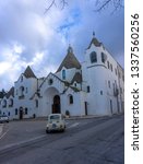 Small photo of Alberobello, Italy - 14.02.19: View of the Church of Sant'Antonio di Padova, known as the Hammer of the Heretics, built for 14 months in 1927 using the same traditional technique as for the trullo.