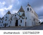 Small photo of Alberobello, Italy - 14.02.19: View of the Church of Sant'Antonio di Padova, known as the Hammer of the Heretics, built for 14 months in 1927 using the same traditional technique as for the trullo.