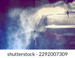 Summer car wash. Car cleaning with high pressure water.