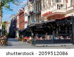 Small photo of AMSTERDAM, THE NETHERLANDS - September 24, 2021: Outdoor terraces getting busy after pandemic of the coronavirus disease (COVID-19) scourge, Leidseplein is square at southern end of central canal ring